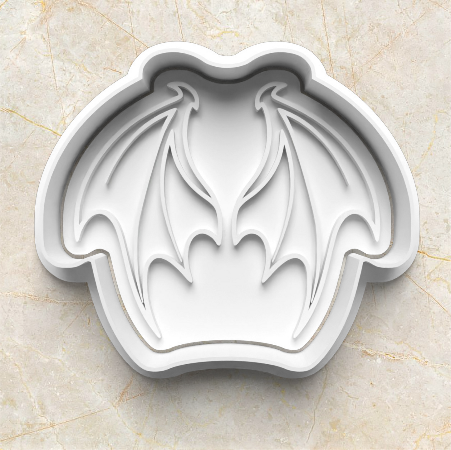 dragon wings shaped cookie cutter on a beige marble background Dragon Set Cookie Cutter and Stamp