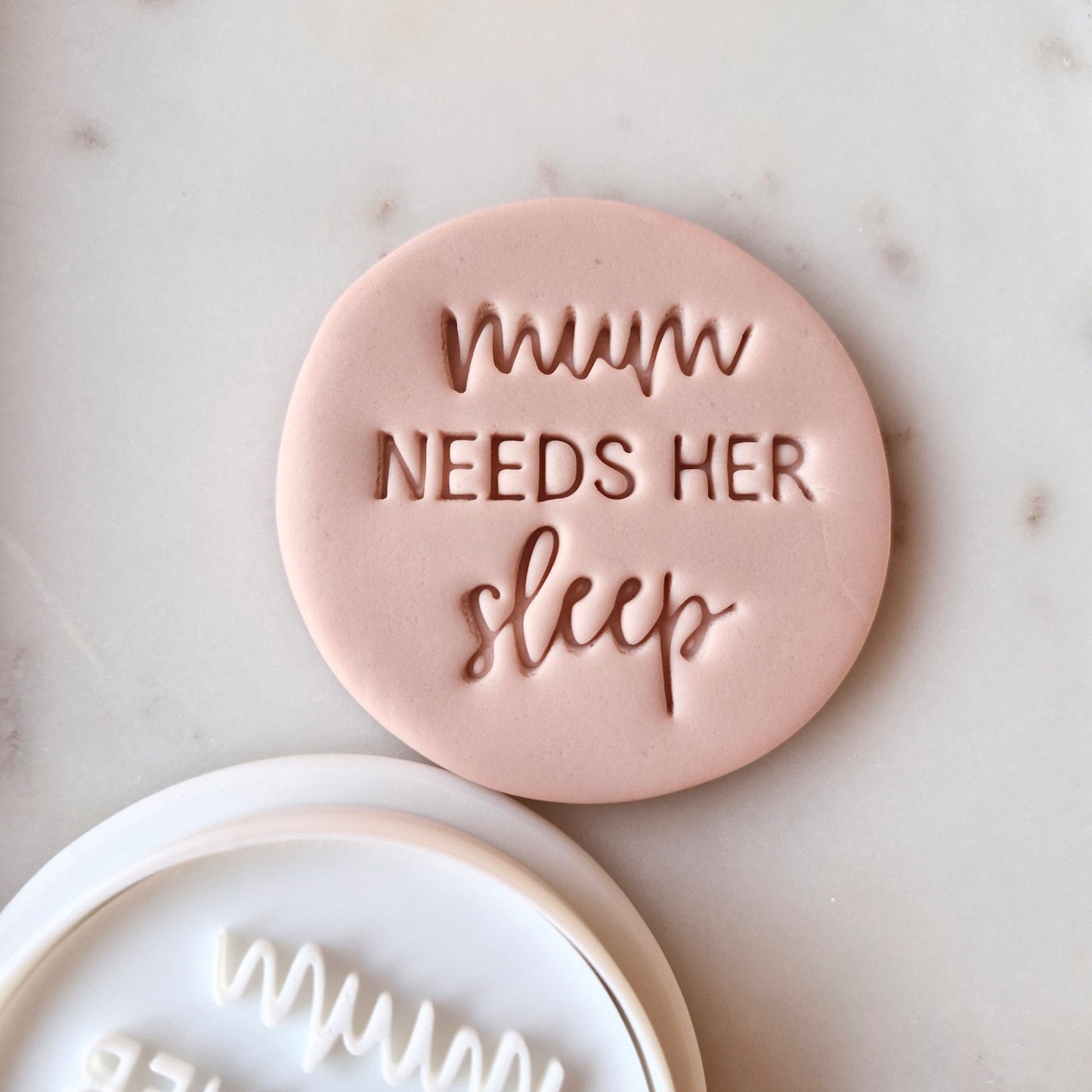Mum Needs Her Sleep Cookie Cutter and Stamp, of the stamp mum needs her sleep circle cutter and stamp, on white marble background Mum Needs Her Sleep Cookie Cutter and Stamp Set