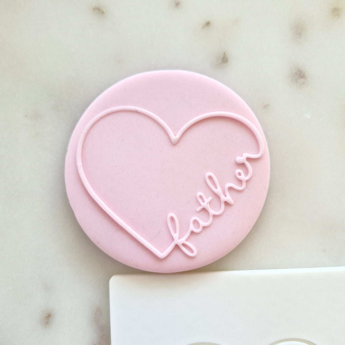 Father's Day Heart Cookie Deboss Plate zoomed in on the fondant 
