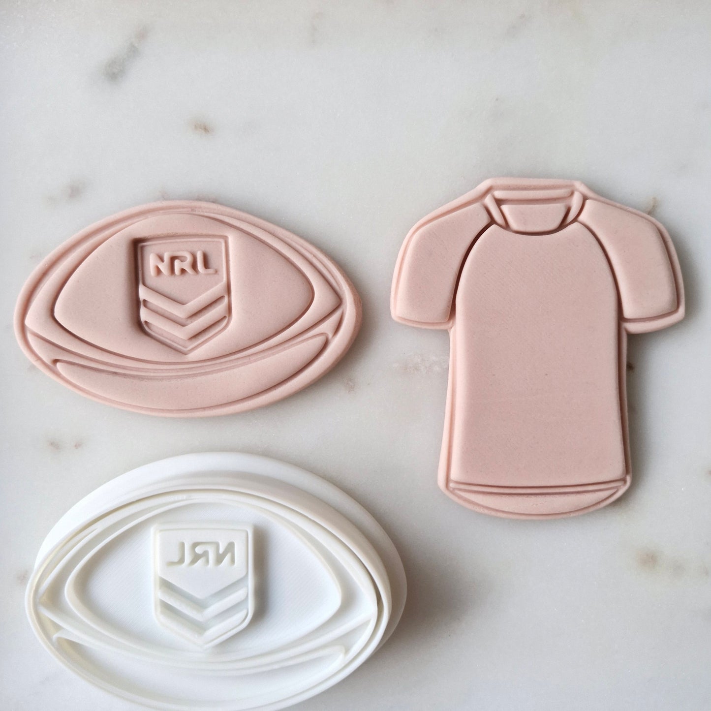 Footy and Jersey Cookie Cutter and Stamp shows both football and jersey next to each other Football and Jersey Cookie Cutter and Stamp Baking tool