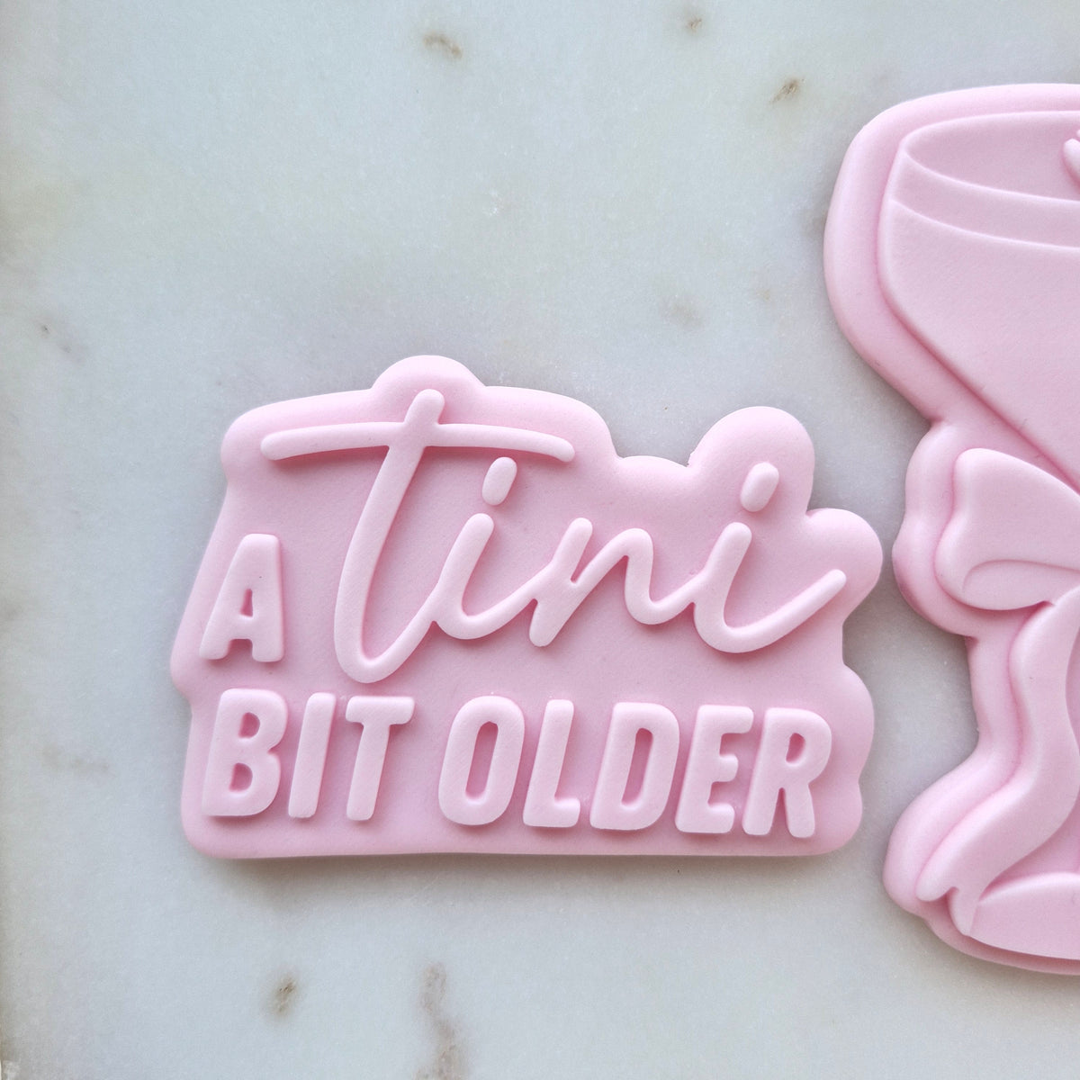 A Tini Bit Older Espresso Martini Set Cookie Cutter and Deboss Stamp zoomed in on a tini bit older stamp A Tini Bit Older Cookie Cutter and Deboss Stamp