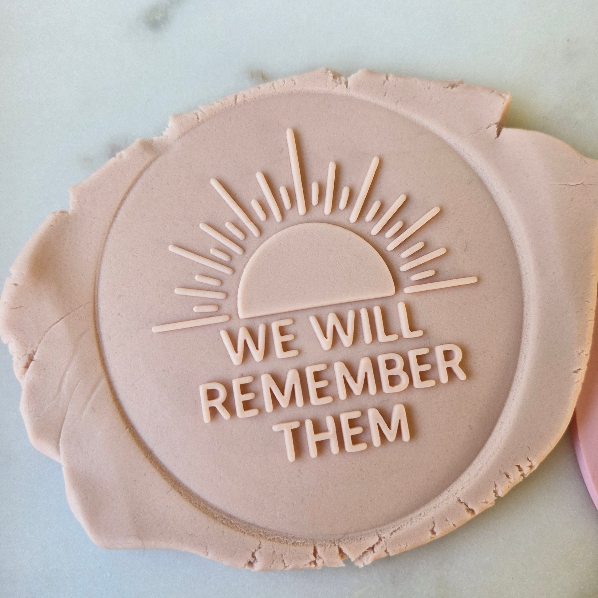 We Will Remember Them Cookie Cutter and Deboss Stamp zoomed in on white marble