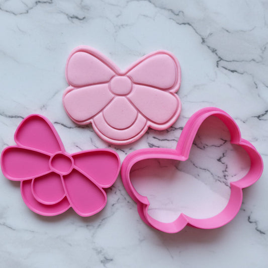 pink fondant stamped and cut by cookie cutter and stamp in the shape of baby dummy with bow Baby Dummy with Bow Cookie Cutter and Stamp