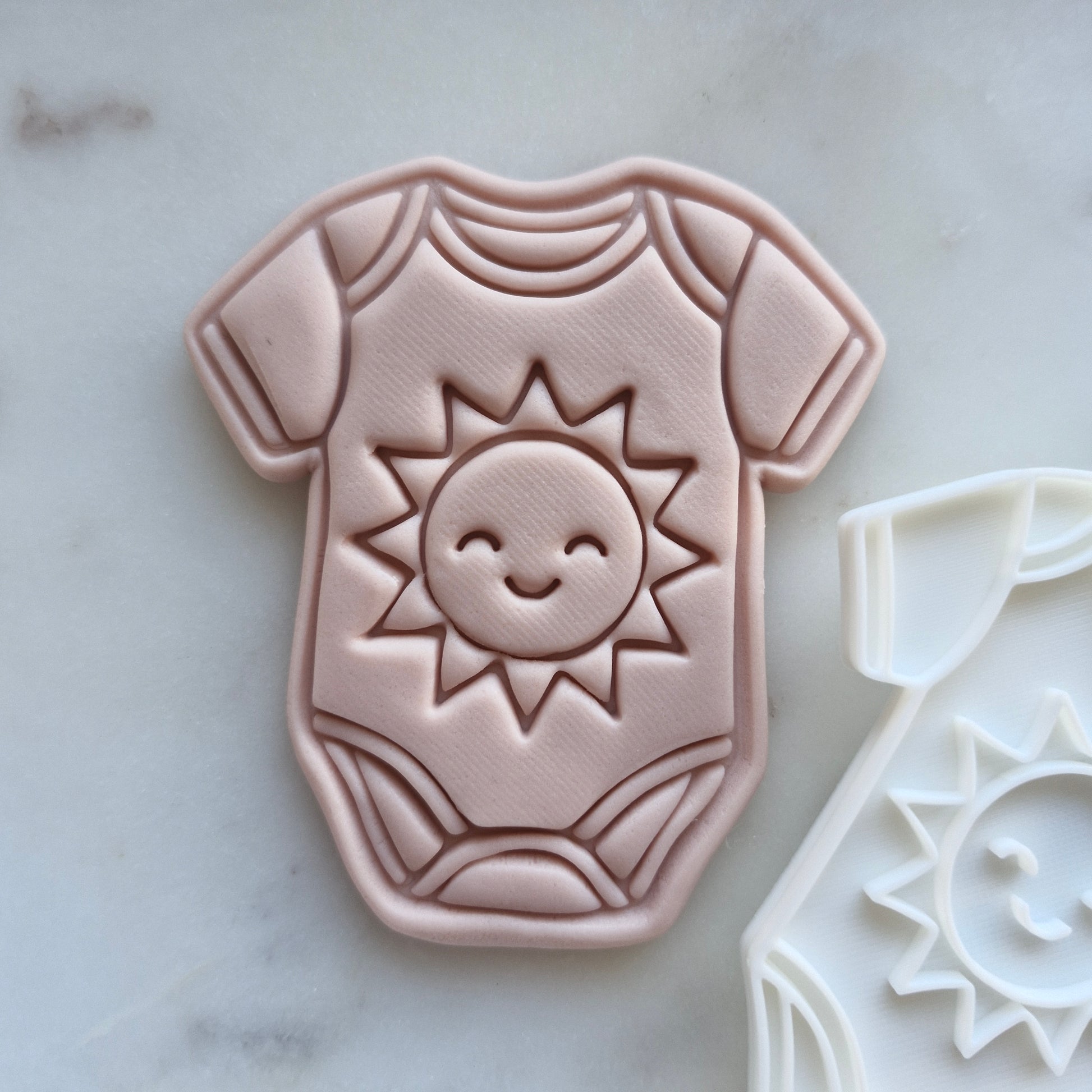 Baby Onesie with Son Cookie Cutter and Emboss Stamp - Baking Tool, zoomed in, background Here Comes the Son Set Cookie Cutter and Stamp Baking Tool Baby Onesie with Son Cookie Cutter and Stamp