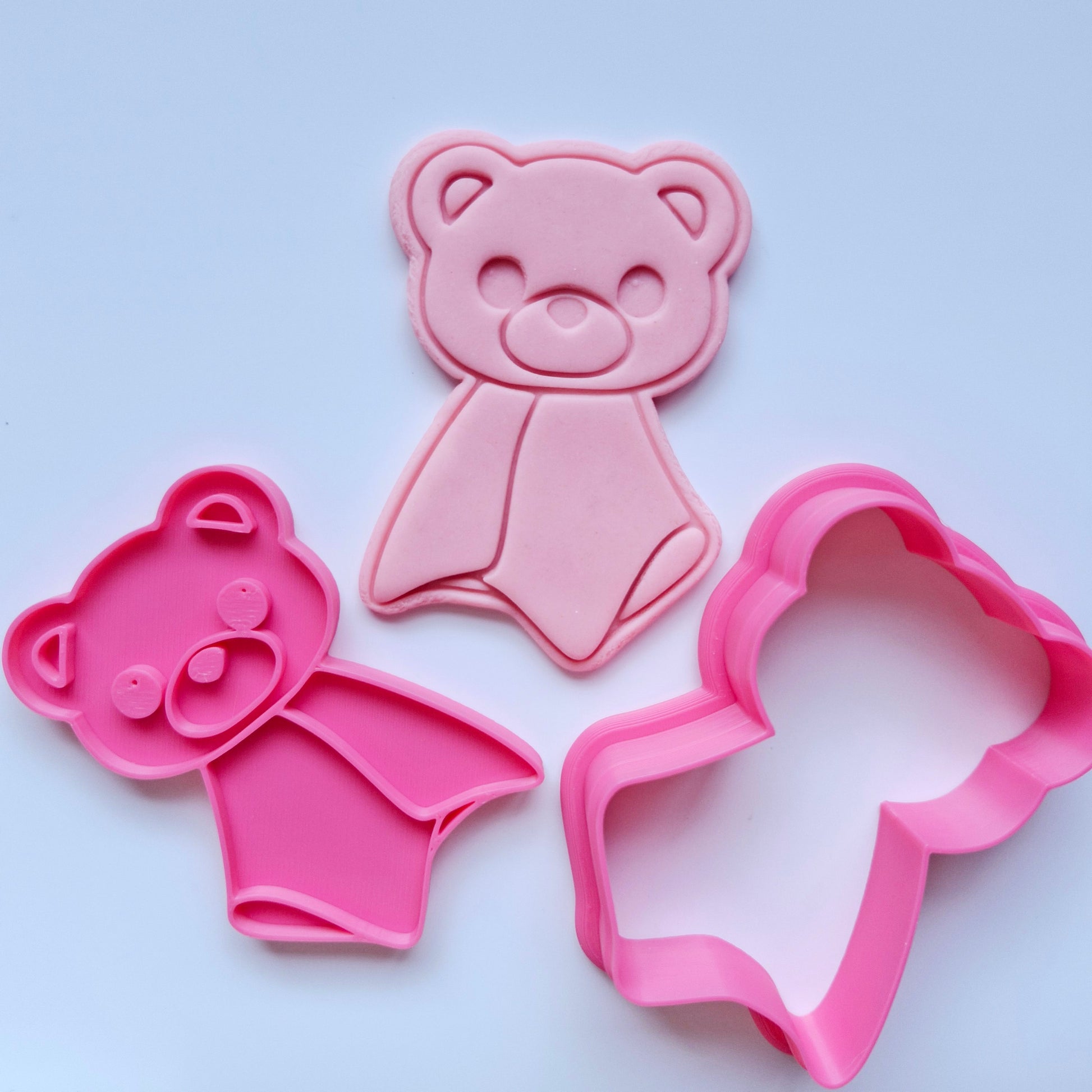Bear Lovey Cookie Cutter and Stamp, pink cookie cutter and stamp, stamped pink fondant giving it the shape of a lovey with a bear head