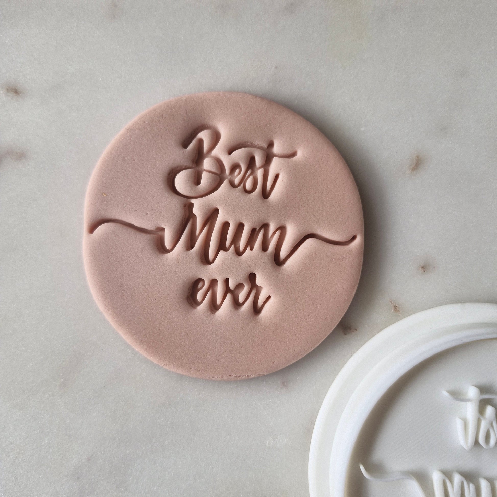 Best Mum Ever Cookie Cutter and Stamp zoomed in on white marble background