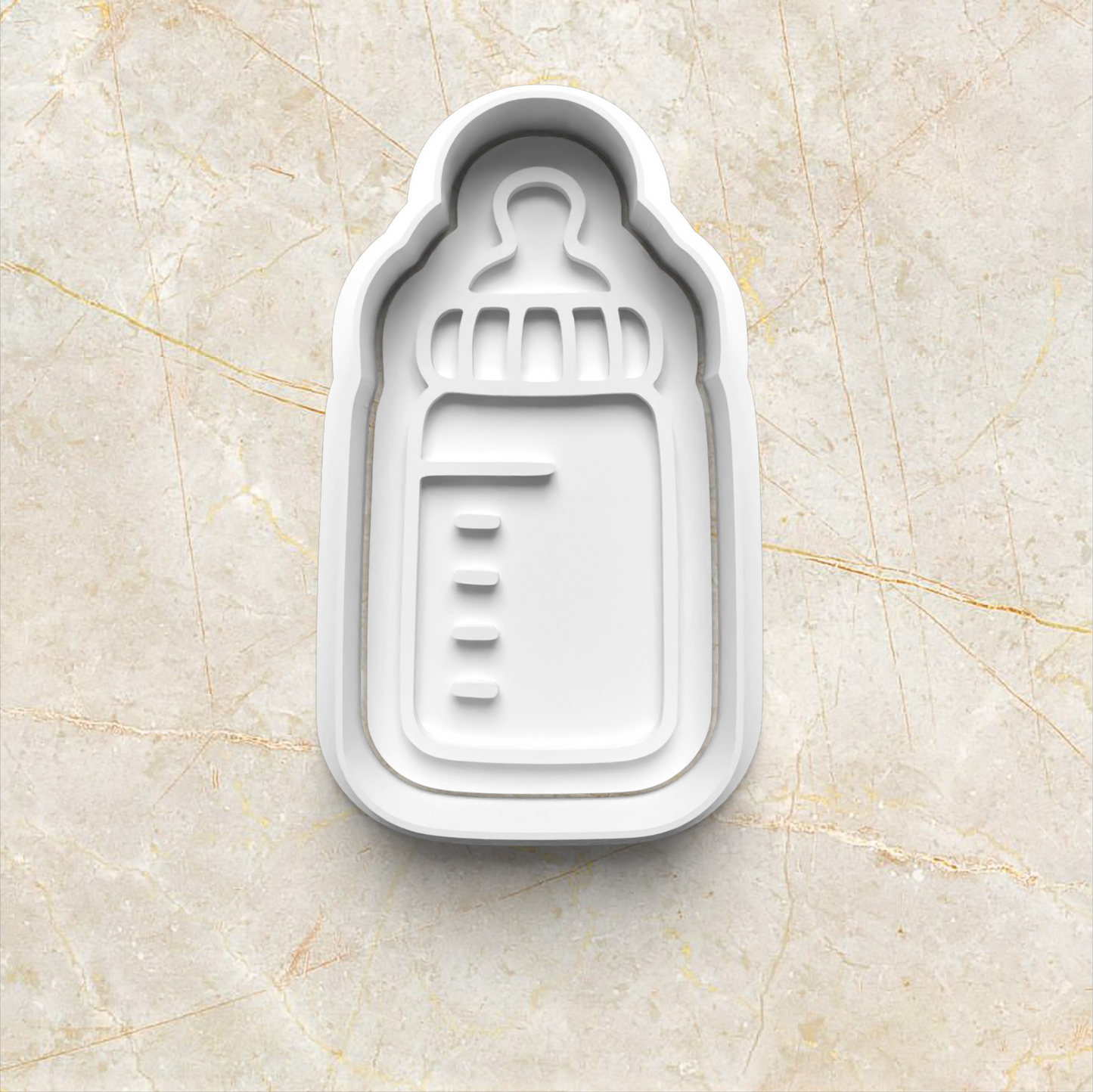 Baby Set Cookie Cutter and Emboss Stamp - Baking Tool, in the shape of baby bottle on yellow marble