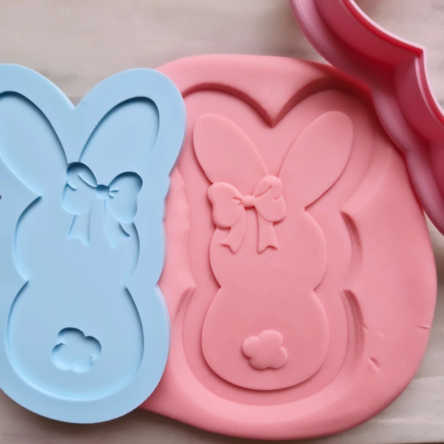 debosser of bunny stamped onto fondant with cookie cutter in the right corner of the picture Bunny with Bow Cookie Cutter and Deboss Stamp 