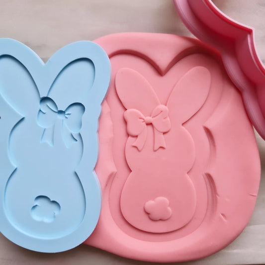 debosser of bunny stamped onto fondant with cookie cutter in the right corner of the picture Bunny with Bow Cookie Cutter and Deboss Stamp 