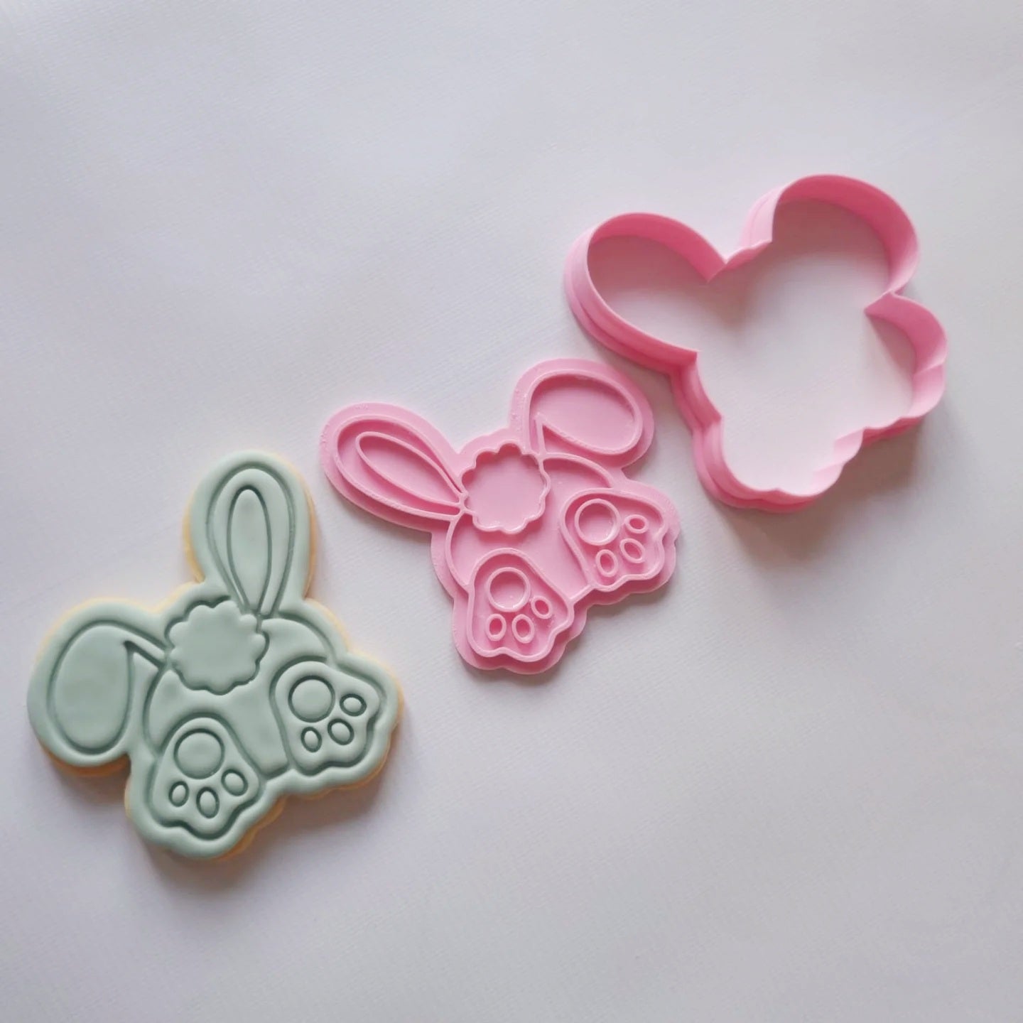bunny bum with ears in the format of sugar cookie and cookie cutter and stamp all laying flat on white background Bunny Bum with Ears Cookie Cutter and Stamp