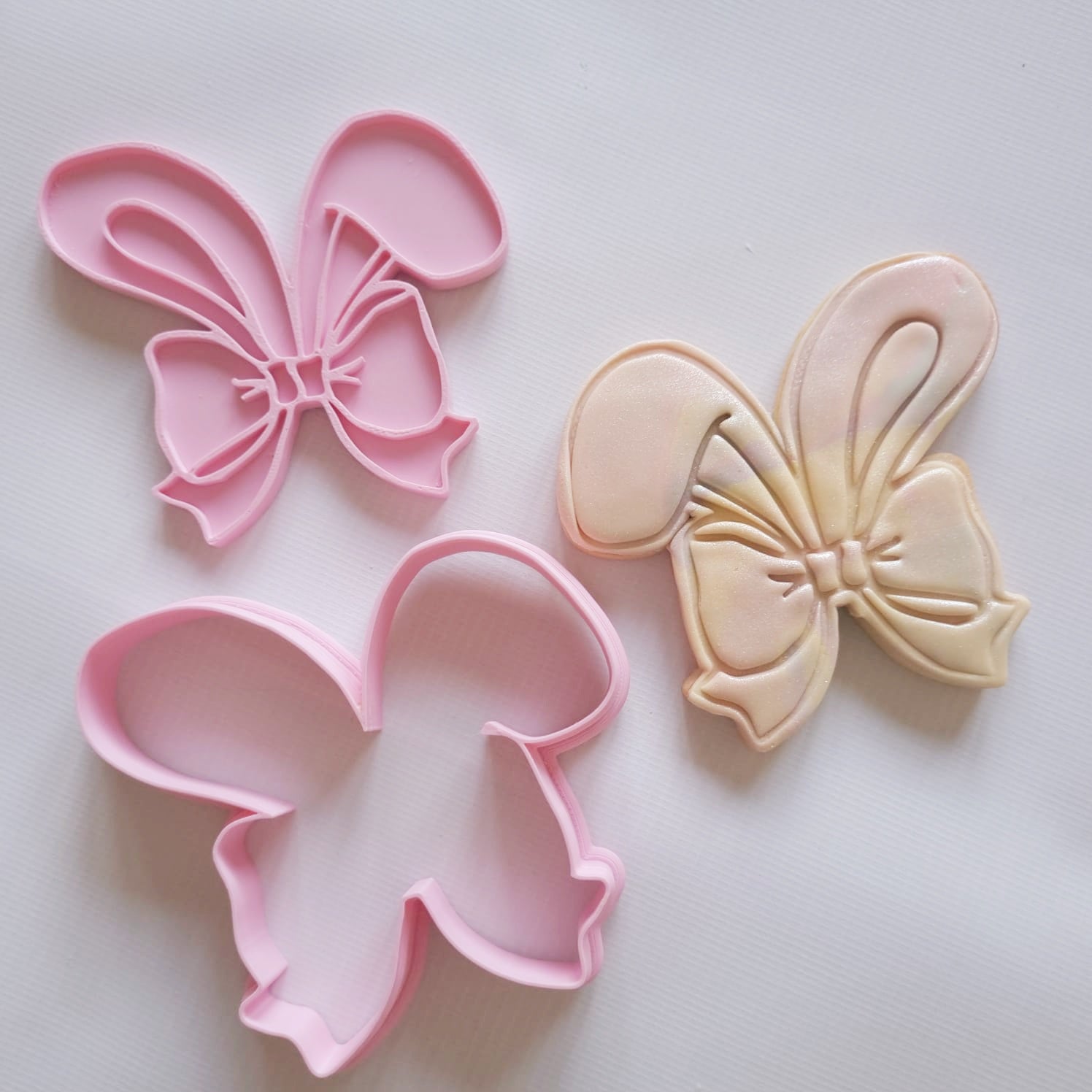 sugar cookie and cookie cutter with stamp of bunny ears wrapped in a bow Coquette Bunny Ears Cookie Cutter and Stamp