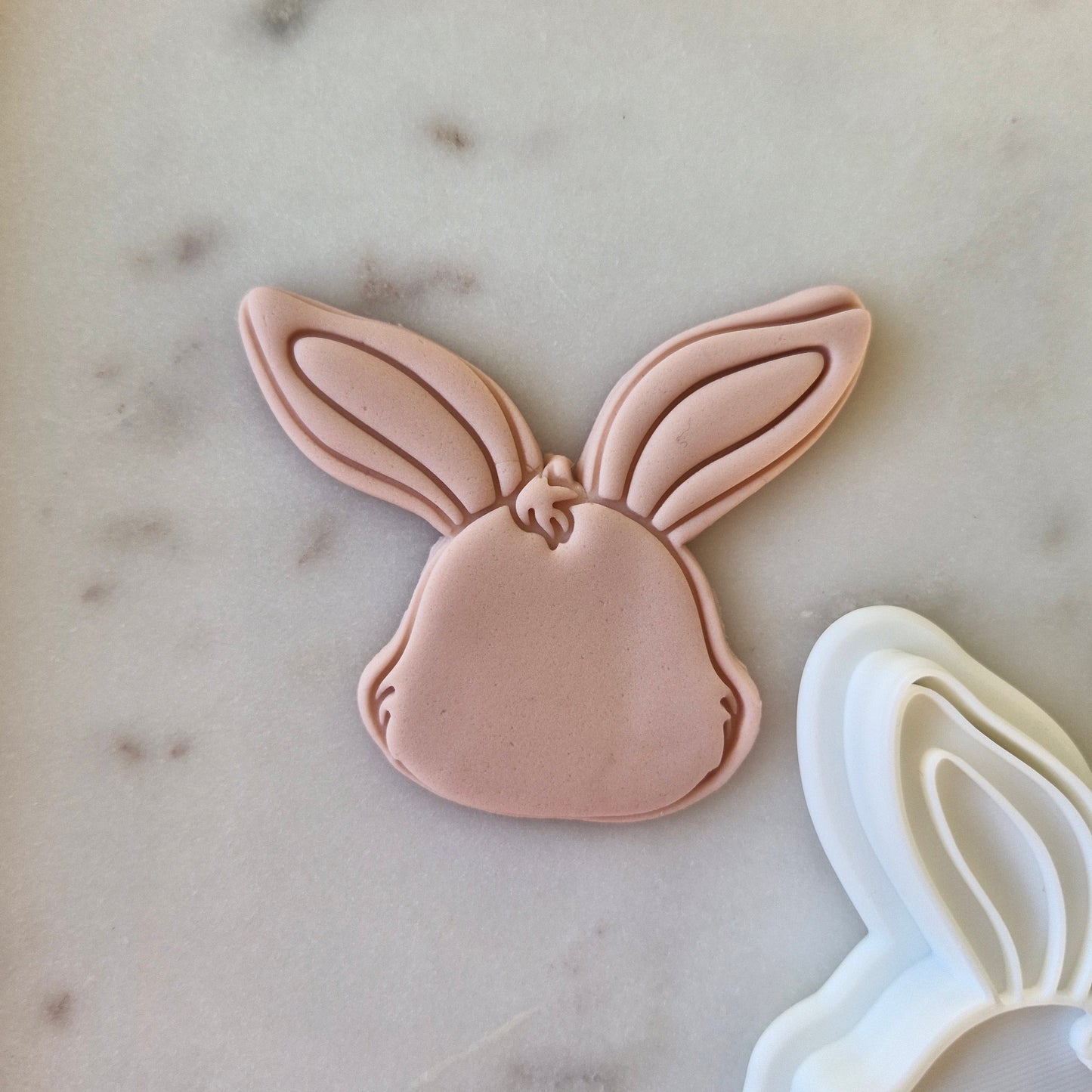  Bunny Head Cookie Cutter and Stamp on fondant and white marble background