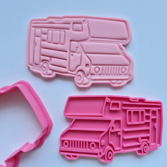 pink fondant stamped and cut in the shape of a caravan with pink cookie cutter and stamp on white background zoomed in Caravan Cookie Cutter and Stamp 