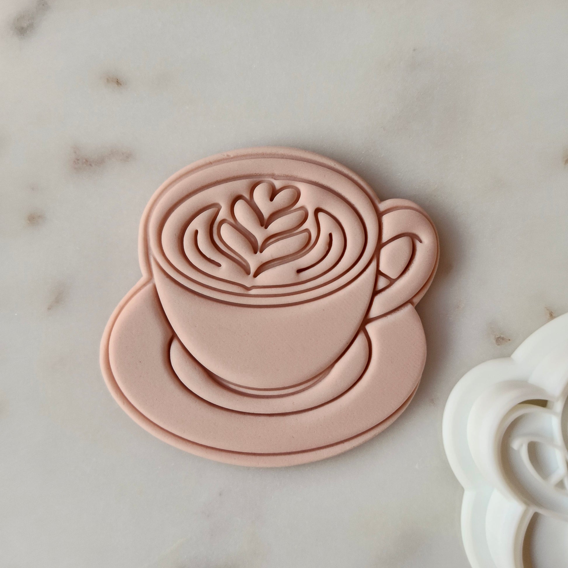 Mum Fuel Set Cookie Cutter and Stamp zoomed in on the coffee cup with artwork in it, on white marble background Coffee Cup Cookie Cutter and Stamp