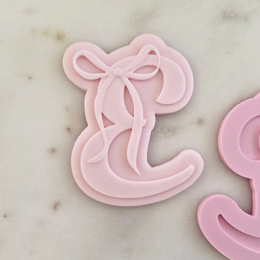 Letter E with Bow Cookie Cuter and Stamp zoomed in