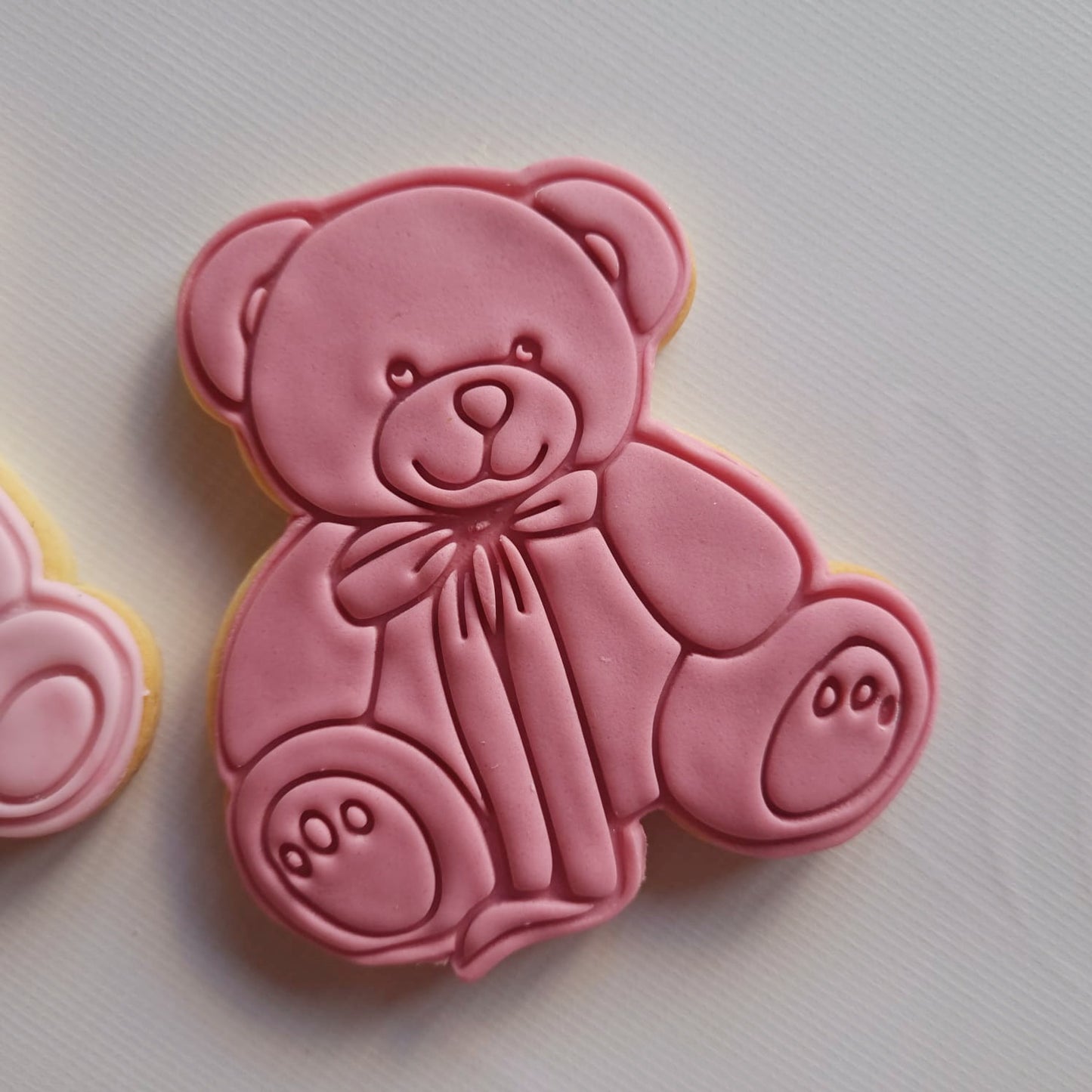 sugar cookie in the shape of a bear with a big bow, in one colour and white background Coquette Bear Cookie Cutter and Stamp