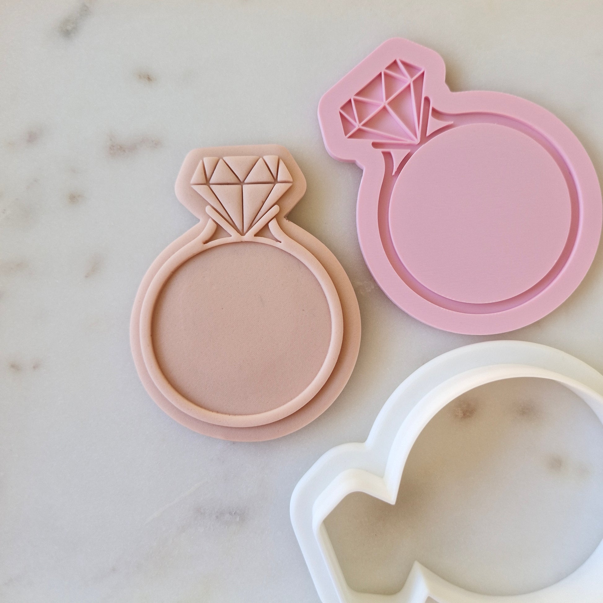 Engagement Ring Cookie Cutter and Stamp zoomed out  on marble stone