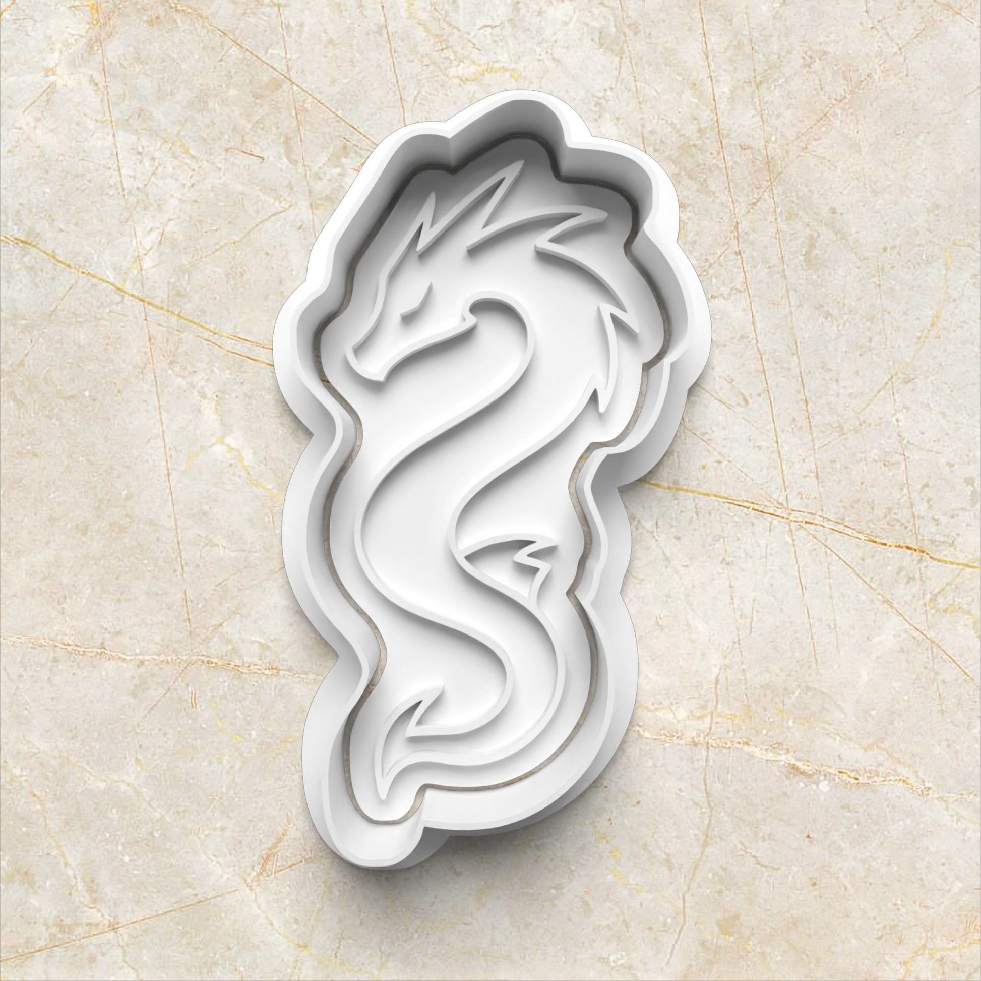 white dragon-shaped cookie cutter on a beige marble background Dragon Set Cookie Cutter and Stamp