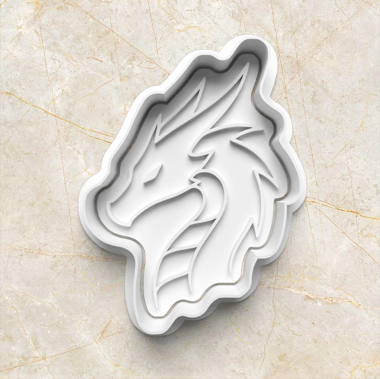 white dragon-shaped cookie cutter on a beige marble surface Dragon Set Cookie Cutter and Stamp