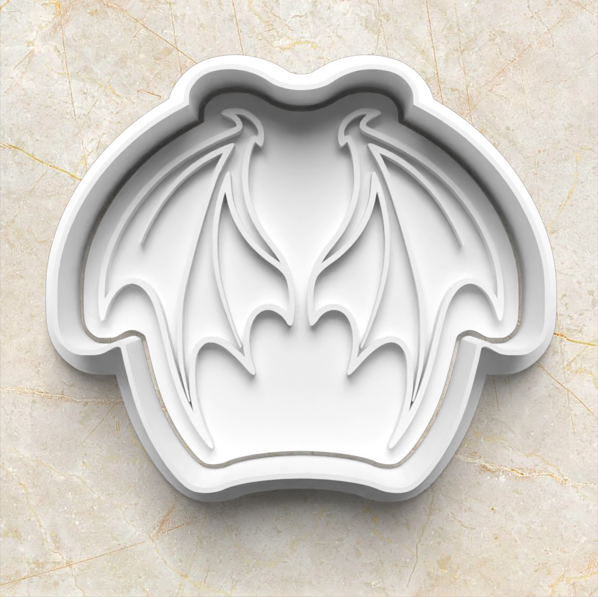 dragon wings shaped cookie cutter on a beige marble background Dragon Set Cookie Cutter and Stamp