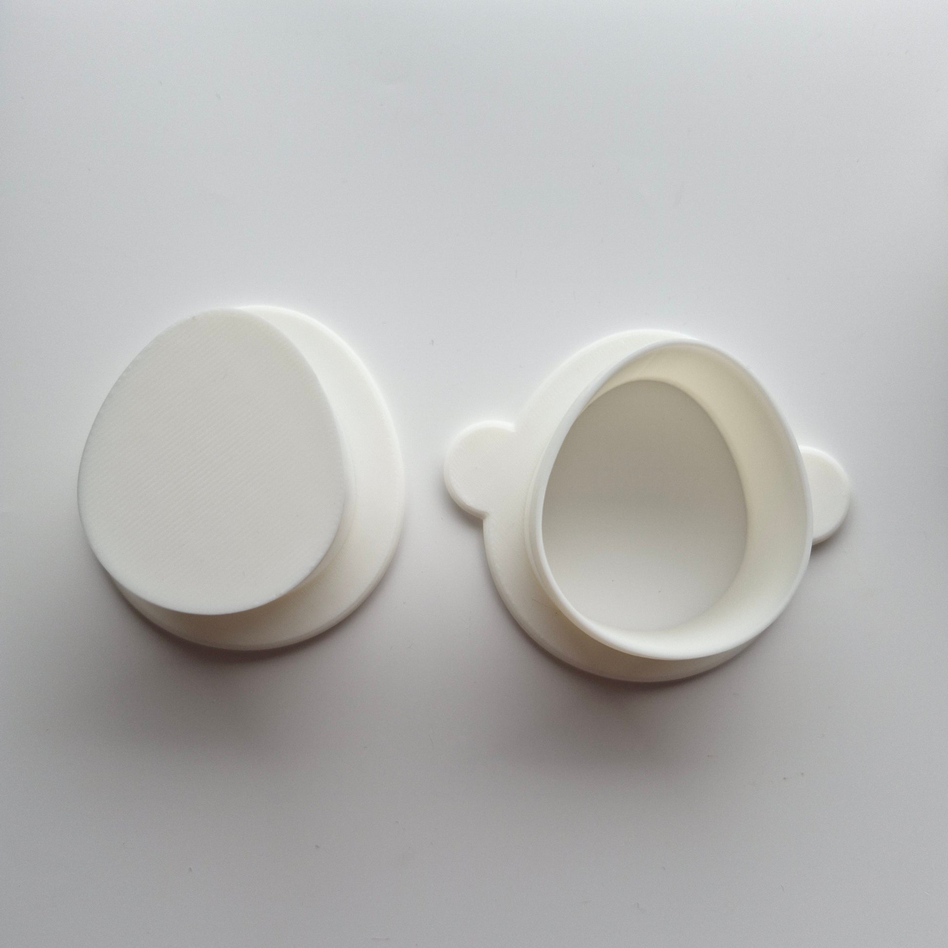 Egg Cake Pop Mould zoomed out on cake pop push and cutter on white background