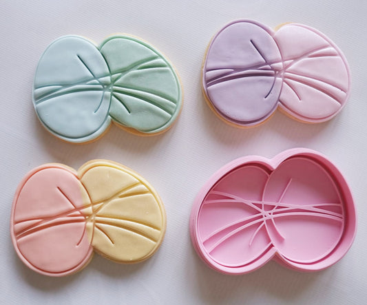 3 sugar cookies and cookie cutter and stamp in the shape of 2 easter eggs wrapped together Easter Eggs Cookie Cutter and Stamp