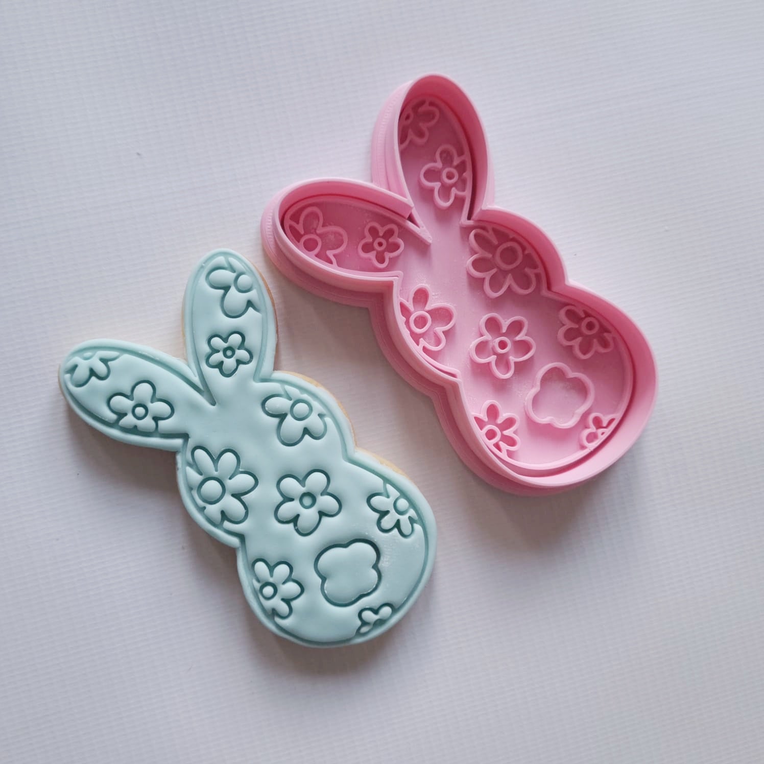 sugar cookie and cookie cutter and stamp, both silhouette of bunny back with daisy pattern Floral Bunny Silhouette Cookie Cutter and Stamp