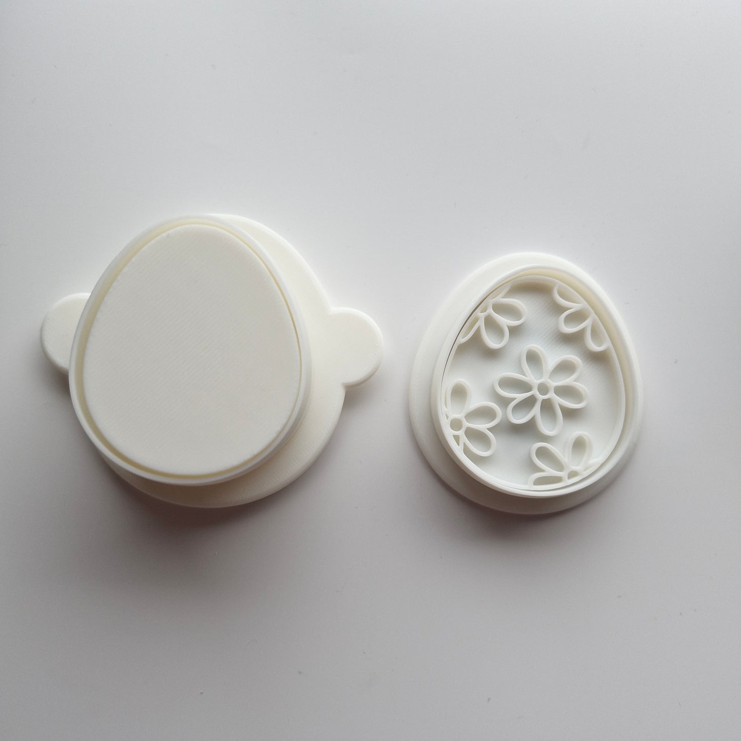 Egg Cake Pop Mould with mini cookie cutter and stamp on white background