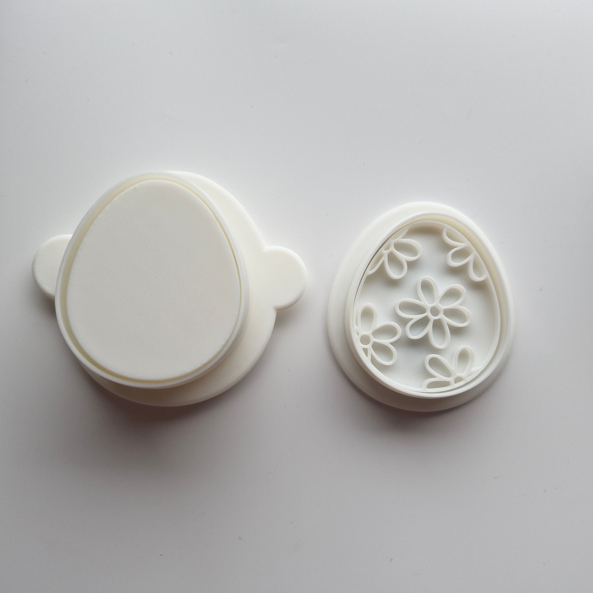 Egg Cake Pop Mould with mini cookie cutter and stamp on white background