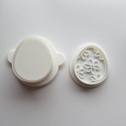Egg Cake Pop Mould with mini cookie cutter and stamp on white background