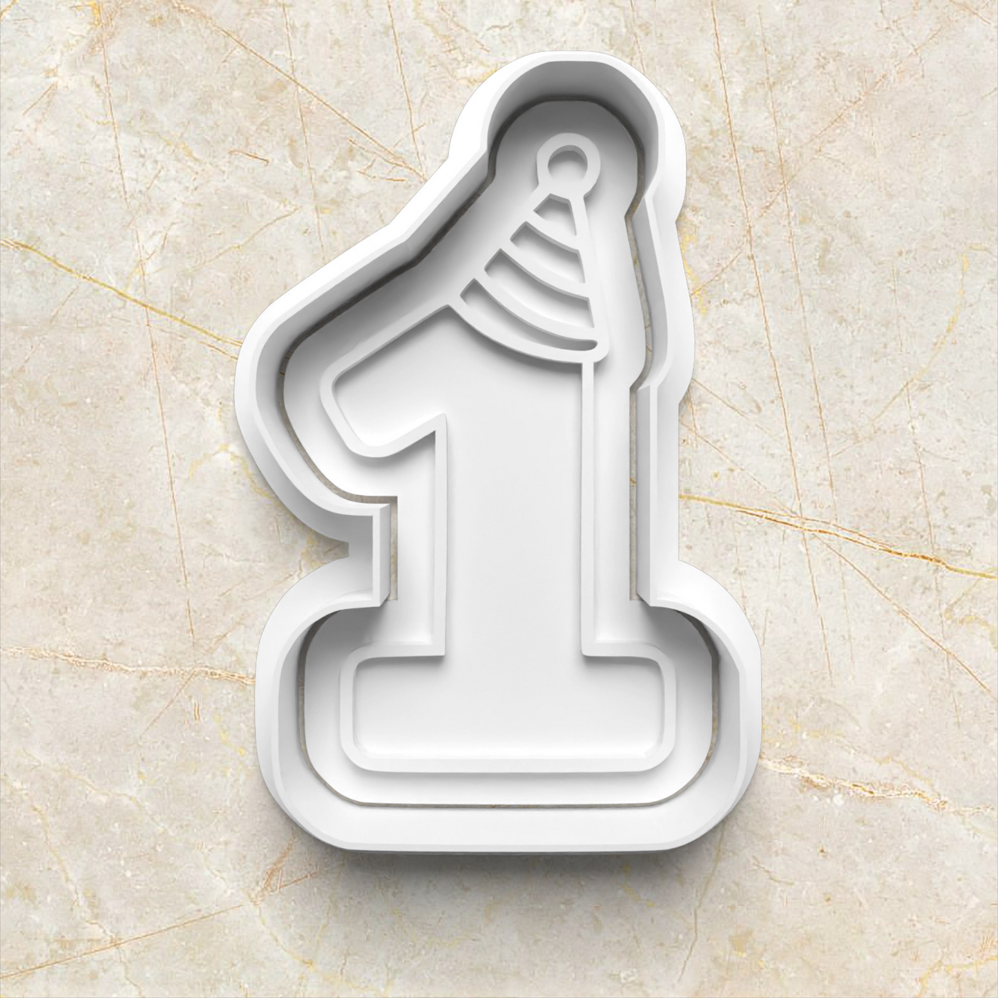 Beary First Birthday Cookie Cutter and Stamp, one with party hat on marble background