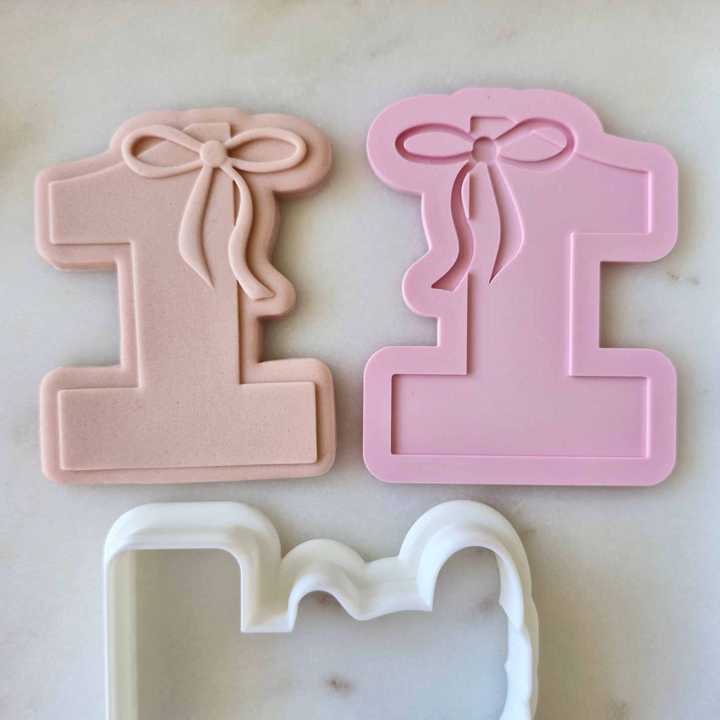 One With Bow On Top Cookie Cutter and Stamp with stamped fondant zoomed out