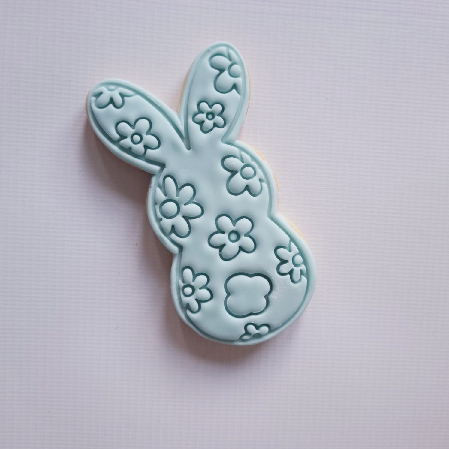 sugar cookie in the format of bunny with daisy patter on it on white background Floral Bunny Silhouette Cookie Cutter and Stamp Floral Bunny Silhouette Cookie Cutter and Stamp