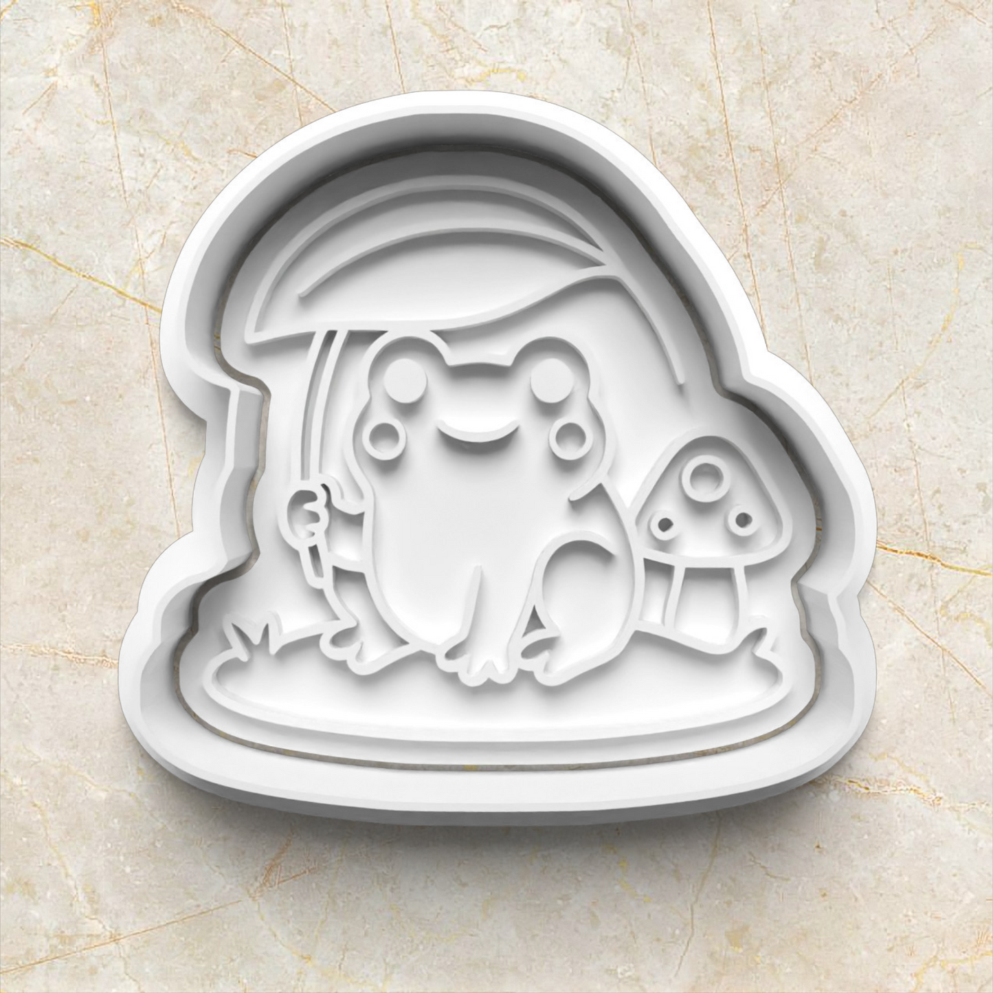 Frog-themed cookie cutter on a marble surface Mushroom Frog Set Cookie Cutter and Stamp