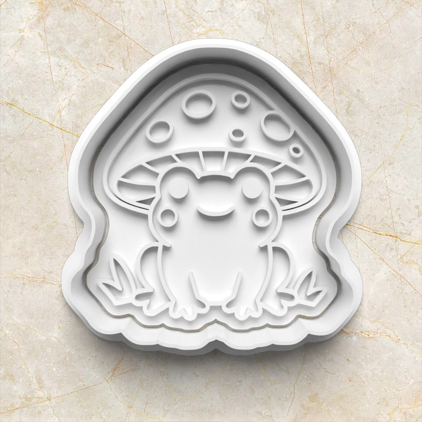 Cookie cutter with a frog with mushroom hat design on a beige marble background Mushroom Frog Set Cookie Cutter and Stamp