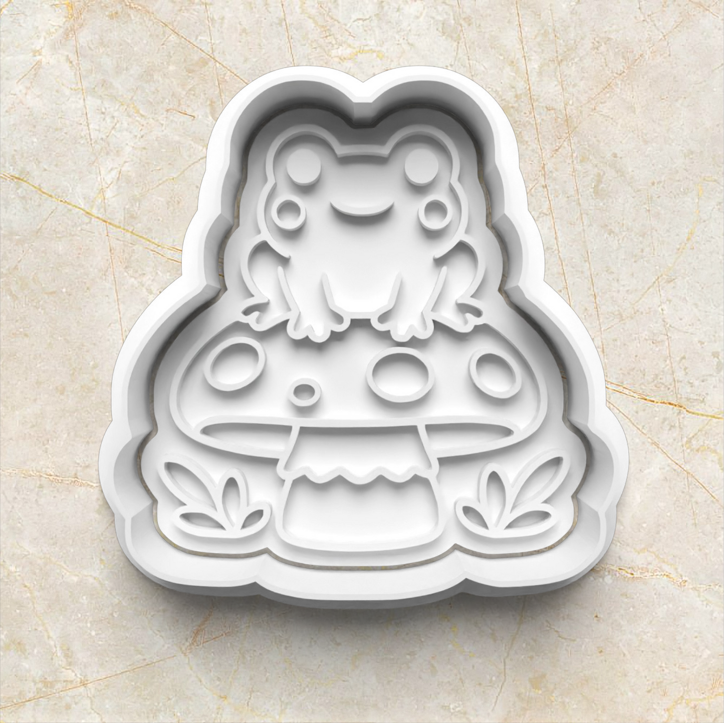 Frog-shaped cookie cutter on a beige marble background Mushroom Frog Set Cookie Cutter and Stamp