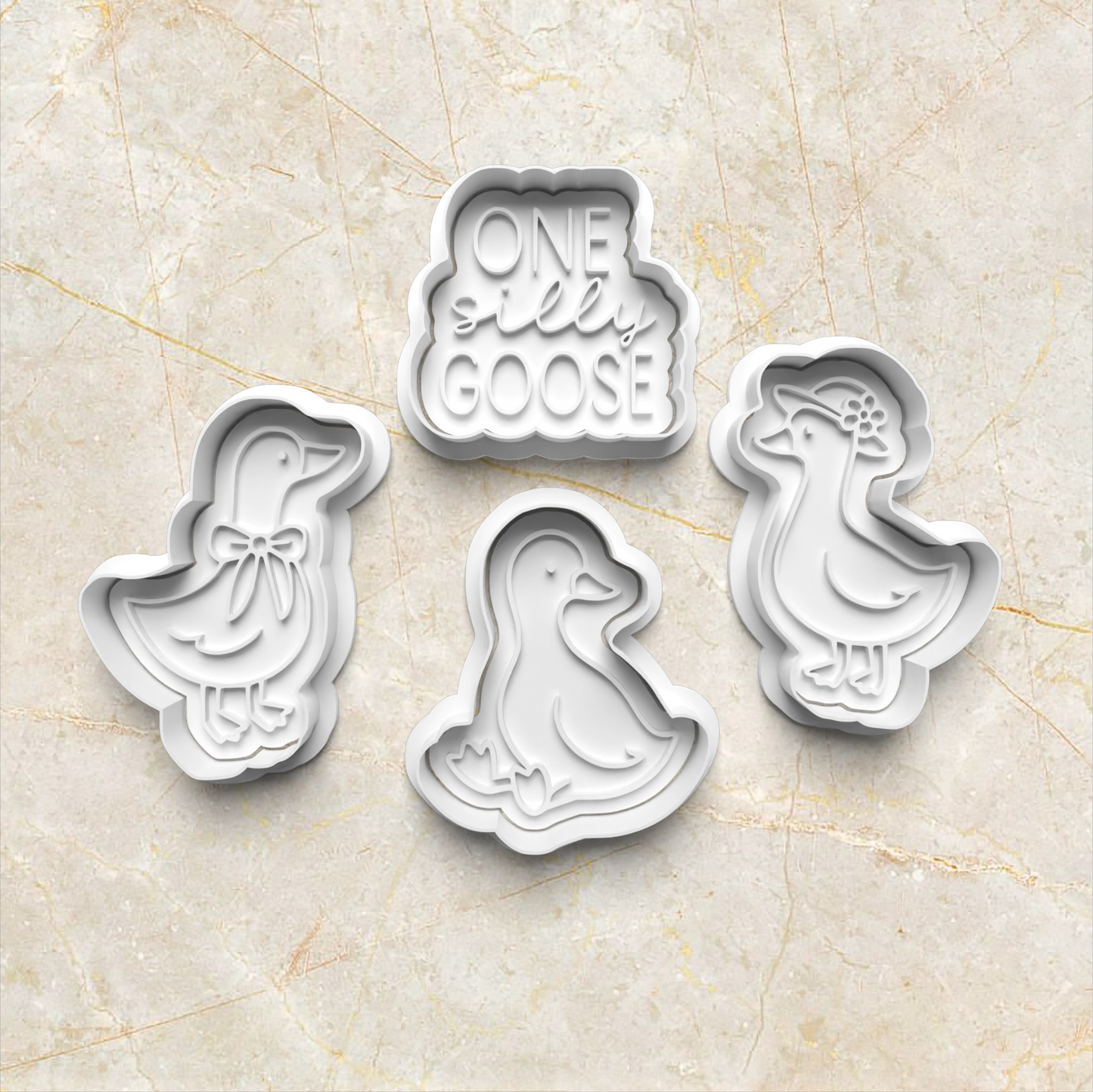 One Silly Goose Cookie Cutter and Emboss Stamp - Baking Tool, set of 4, on yellow marble