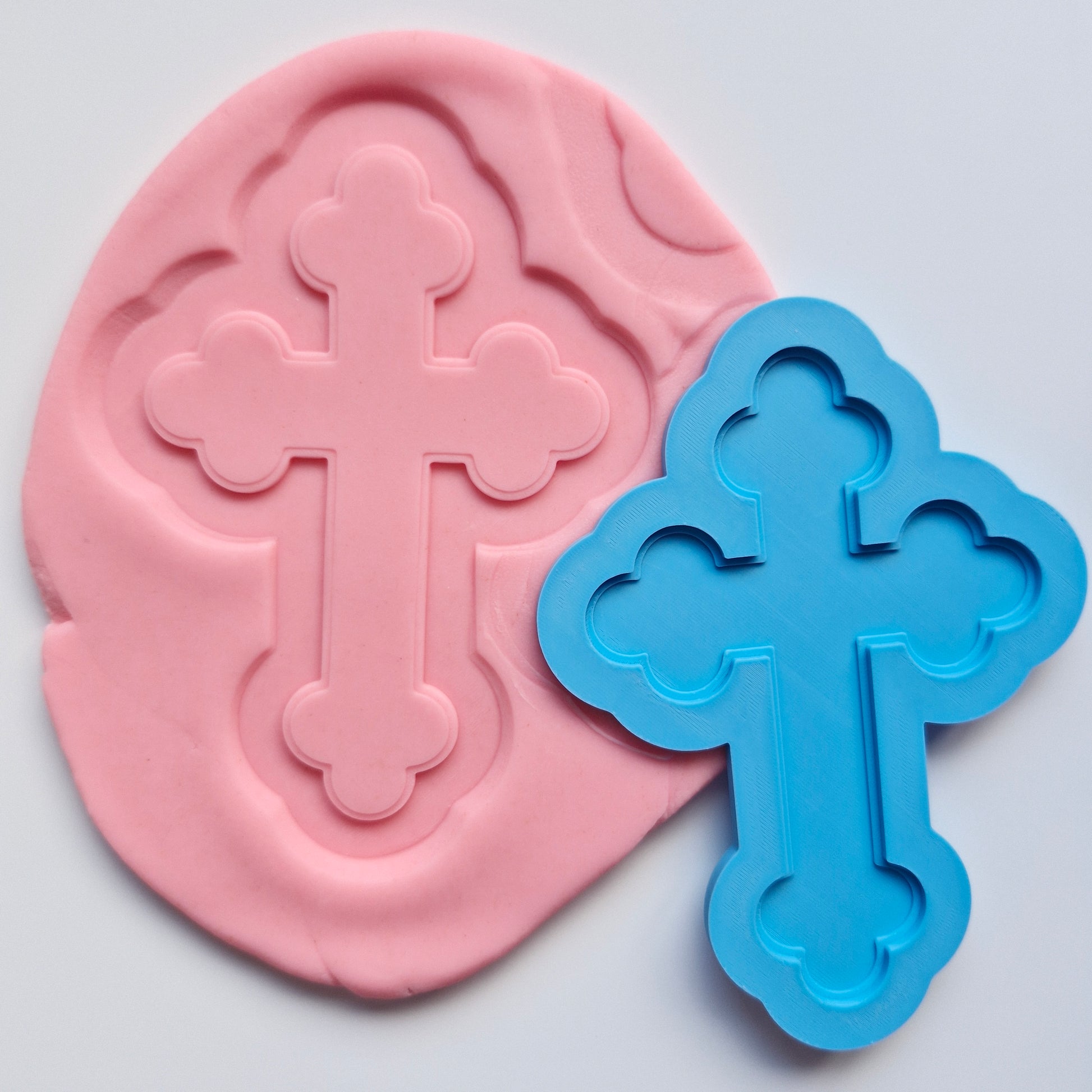 decorative cross deboss stamped on coral coloured fondant with blue deboss stamp Decorative Orthodox Cross Cookie Cutter and Deboss Stamp