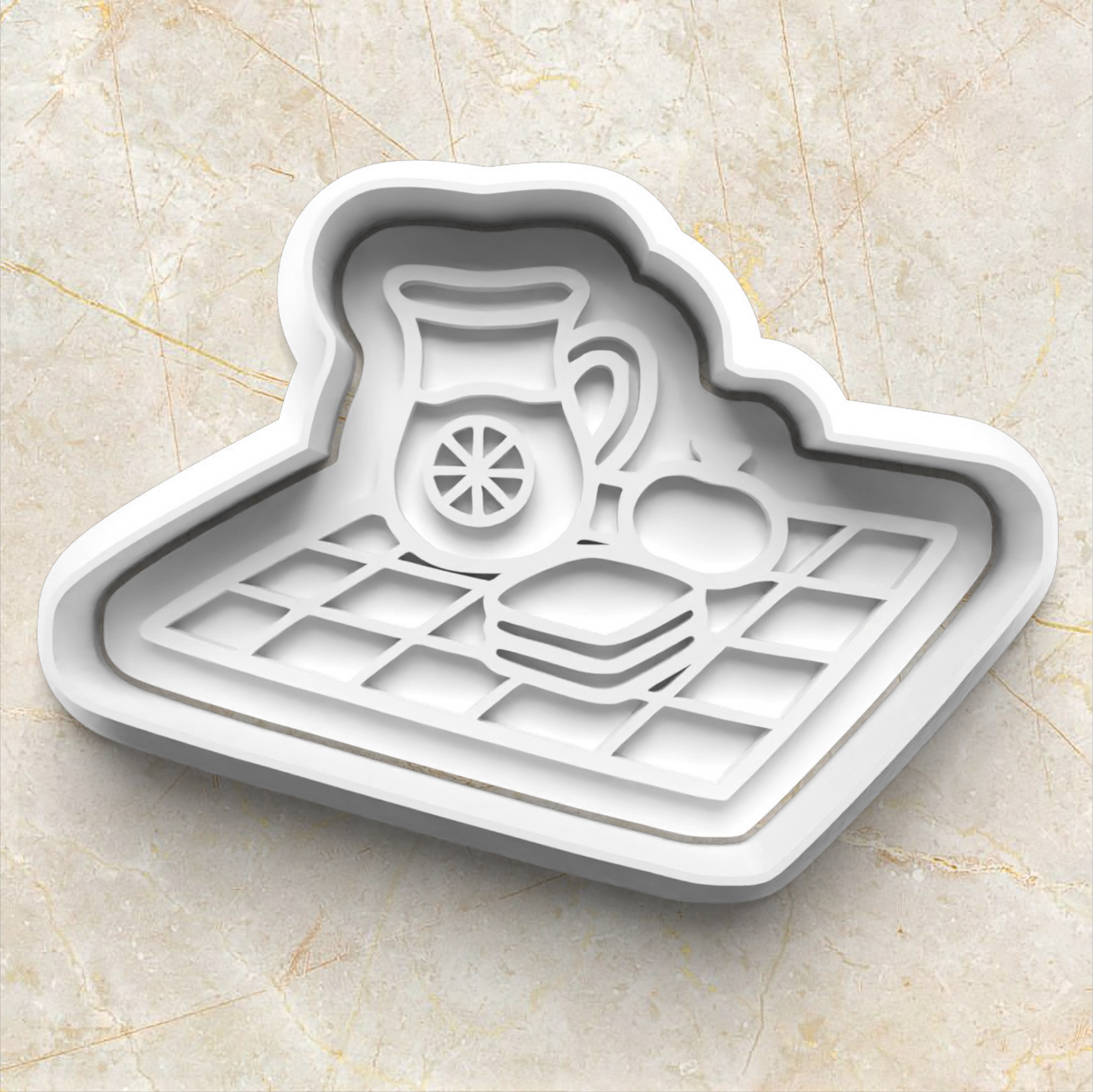 Cookie cutter and stamp in the shape of a picnic blanket, with lemonade jar, apple and sandwich, on beige marble background. Picnic Cookie Cutter and Emboss Stamp