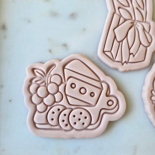 Picnic Platter Cookie Cutter and Stamp zoomed in on white marble background