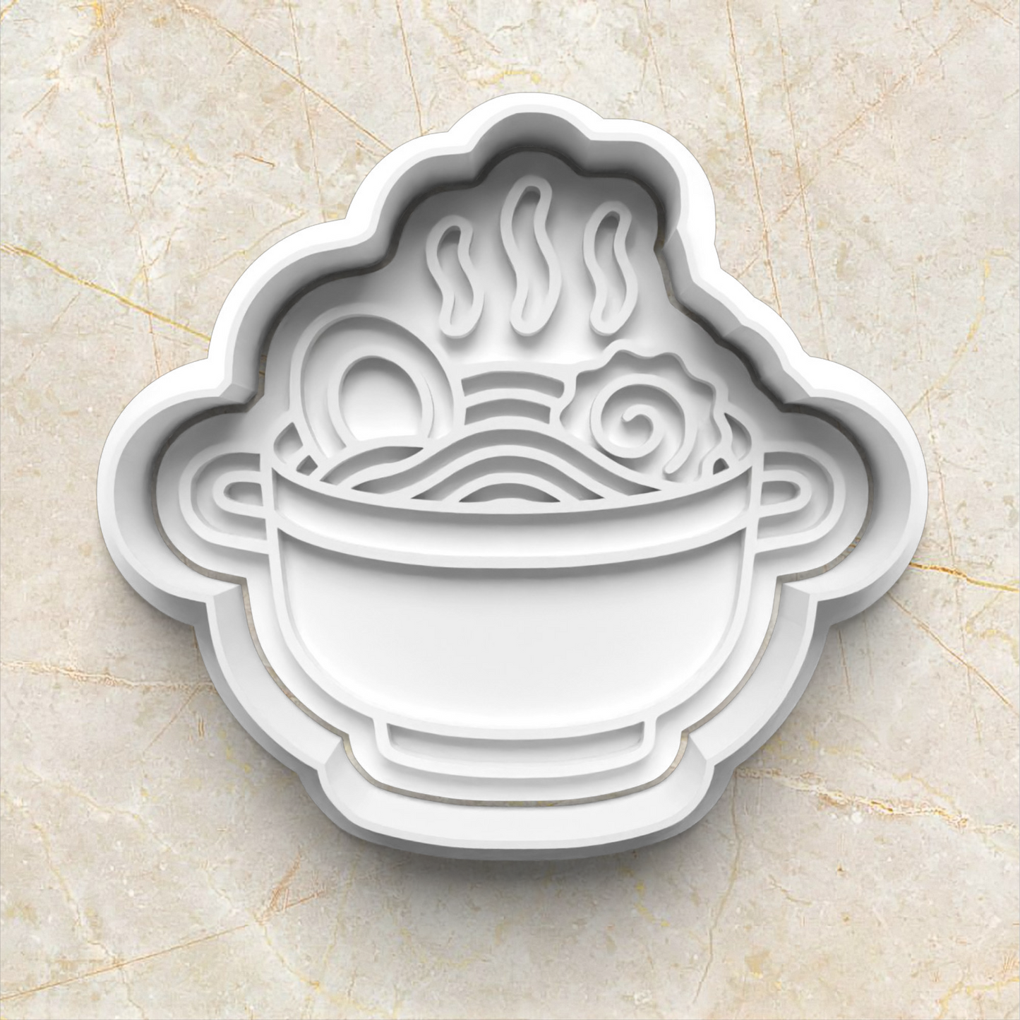 White ceramic pot with ramen noodles and steam design on a beige marble background Ramen Noodles Cookie Cutter and Stamp