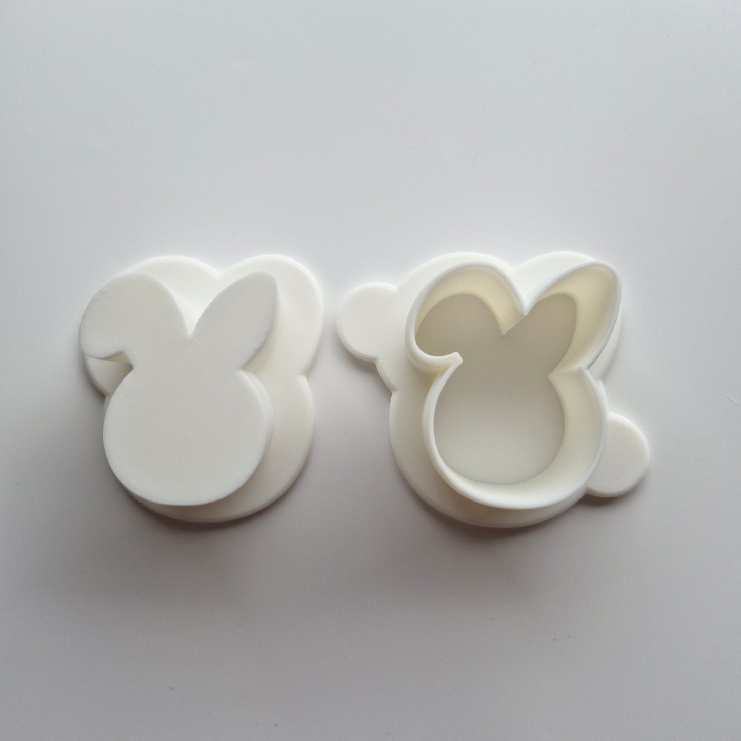 Bunny Head Cake Pop Mould showing separate cake pop cutter and push on white background