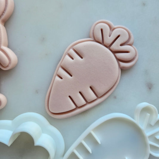 Carrot Cookie Cutter and Stamp - Baking Tool, zoomed in on white marble stone