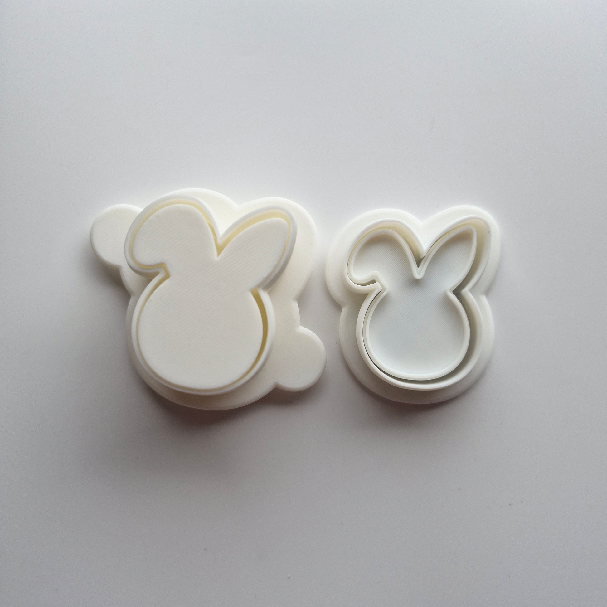 Bunny Head Cake Pop Mould with mini cookie cutter and stamp on white background