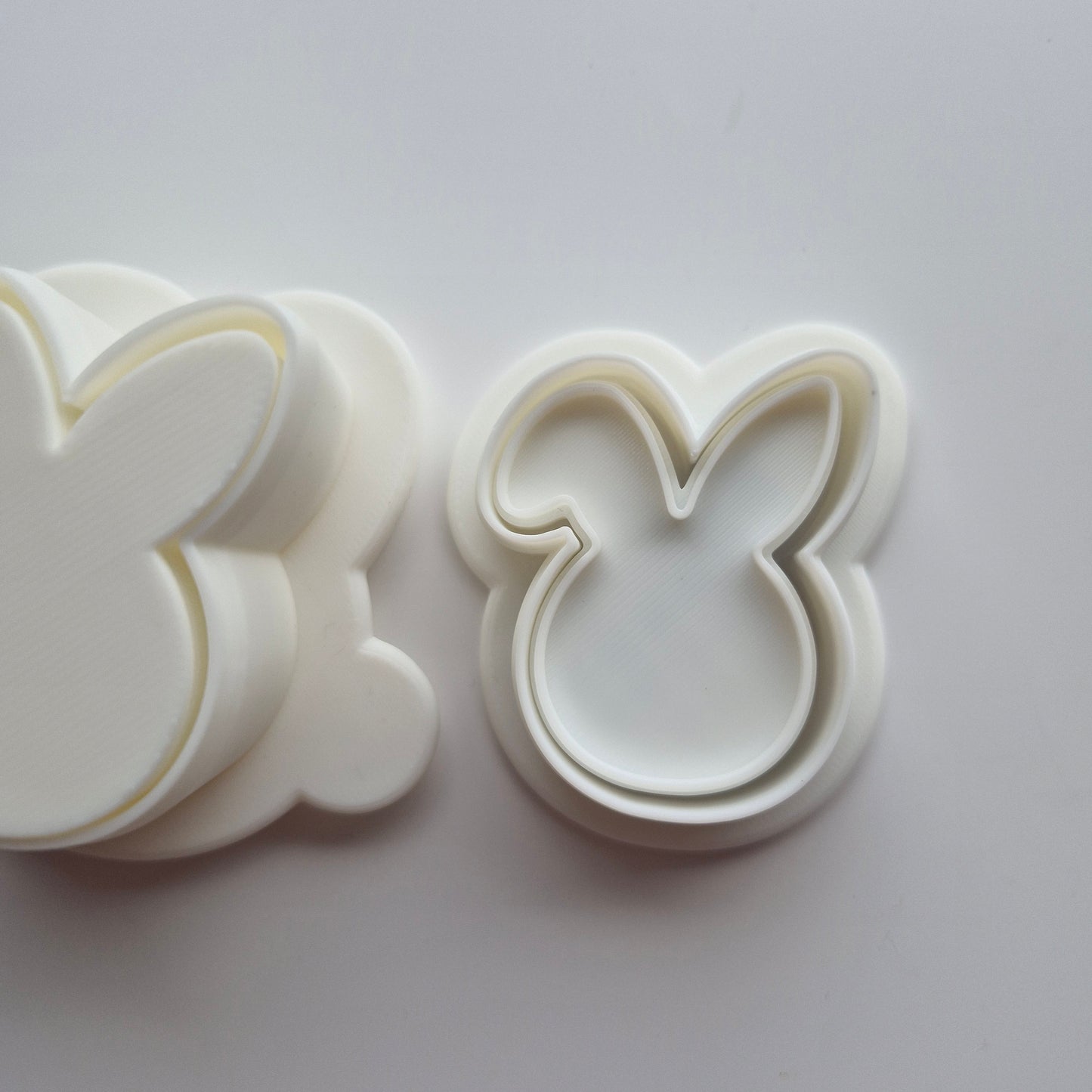 Bunny Head Cake Pop Mould of the cookie cutter and emboss stamp close up, on white background