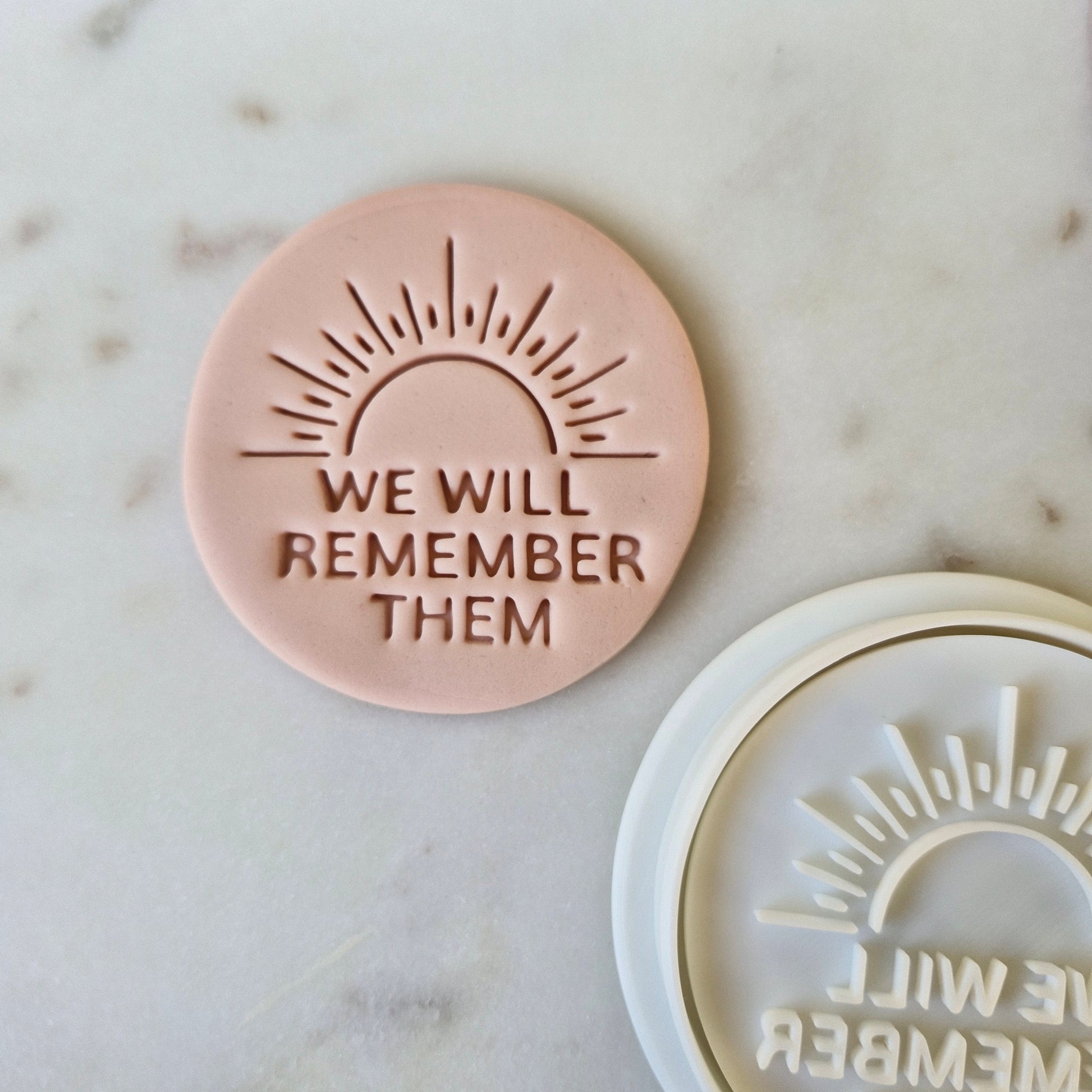 We Will Remember Them Cookie Cutter and Stamp zoomed out on white marble background