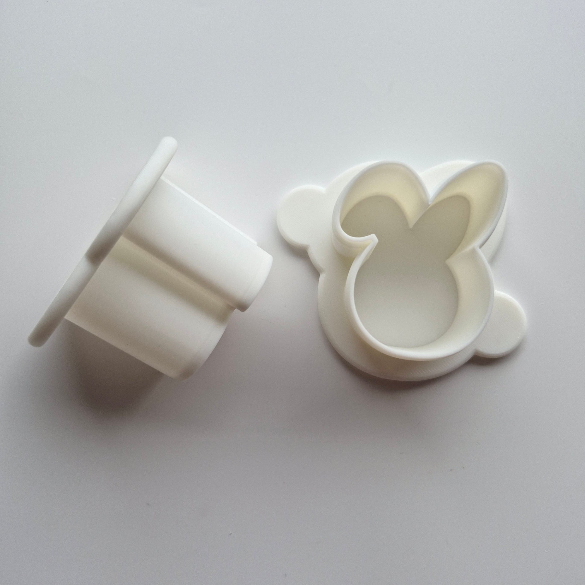 Bunny Head Cake Pop Mould cake pop push on the side and top view of the cutter, on white background