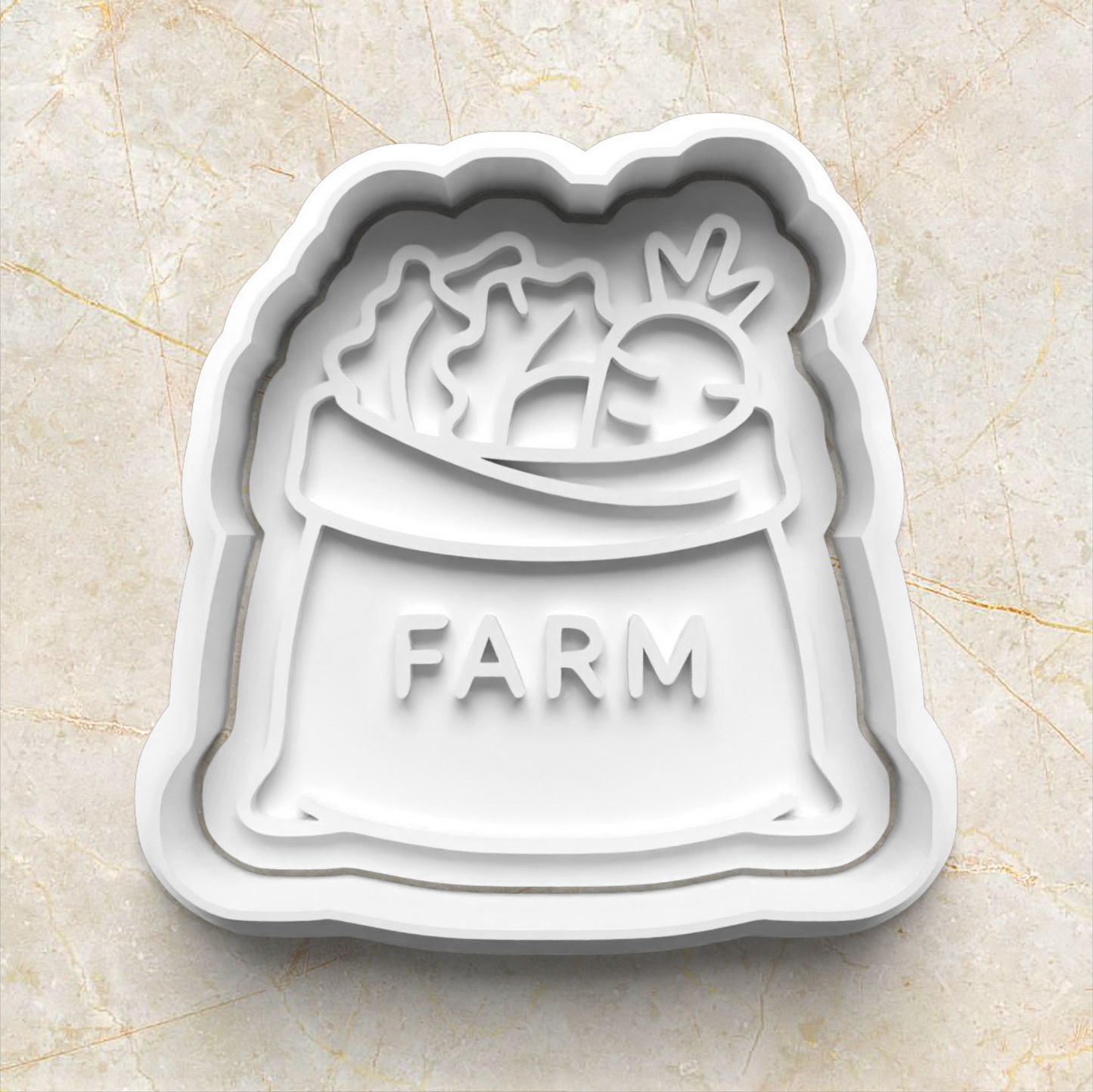 White cookie cutter shaped like a bag with 'FARM' text on a beige surface Farmer's Market Cookie Cutter and Emboss Stamp