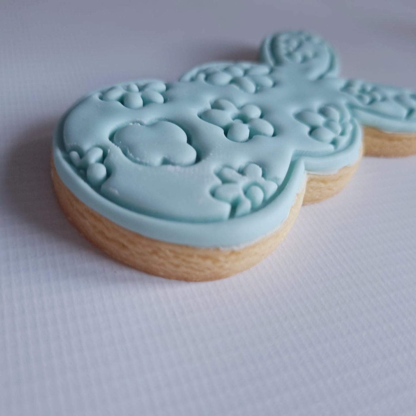 the side of the sugar cookie that's a bunny to show to smooth cut of the cookie cutter Floral Bunny Silhouette Cookie Cutter and Stamp