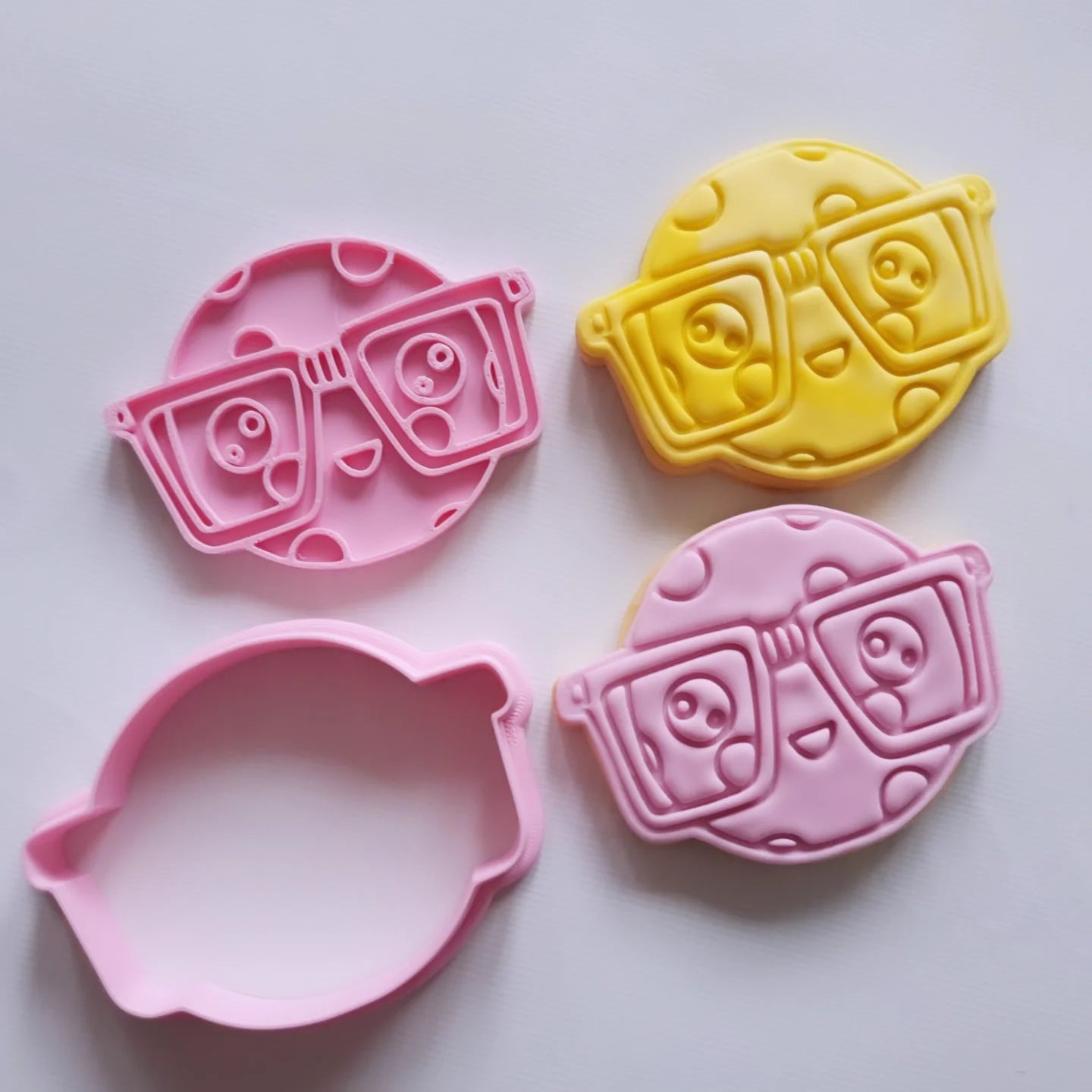 2 sugar cookies and cookie cutter with stamp of the design of smart cookie with nerd glasses on and smiling face Smart Cookie Cookie Cutter and Stamp